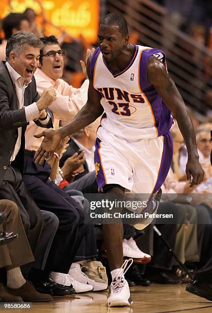 Jason Richardson of the Phoenix Suns celebrates with fans after hitting a three point shot against the Portland Trail Blazers during Game Two of the...