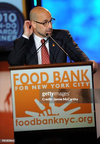 Host Stanley Tucci speaks at the Food Bank for New York City's 8th