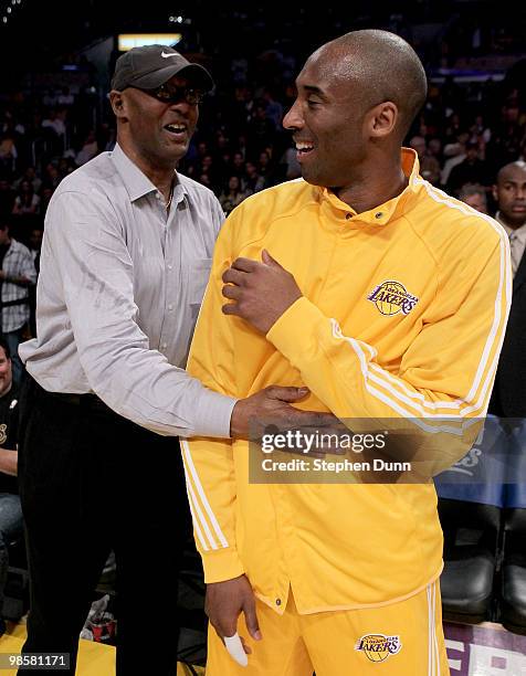 Kobe Bryant of the Los Angeles Lakers laughs with father Joe Jelly Bean Bryant before playing the Oklahoma City Thunder during Game Two of the...