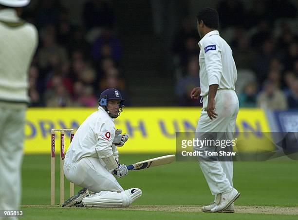 Graham Thorpe of England gets the rough treatment from Waqar Younis of Pakistan on the second day of the first test against Pakistan at Lords Cricket...