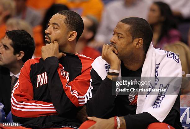 Juwan Howard and Marcus Camby of the Portland Trail Blazers react on the bench during Game Two of the Western Conference Quarterfinals of the 2010...