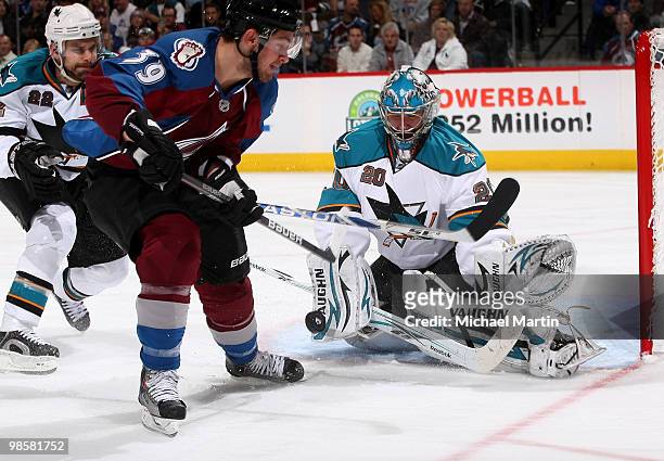 Goaltender Evgeni Nabokov of the San Jose Sharks blocks a shot by T.J. Galiardi of the Colorado Avalanche in Game Four of the Western Conference...