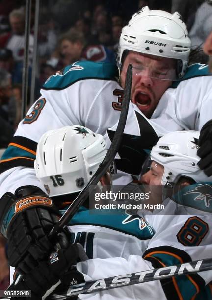 Joe Pavelski of the San Jose Sharks celebrates his game-winning goal with teammates Devin Setoguchi and Douglas Murray against the Colorado Avalanche...