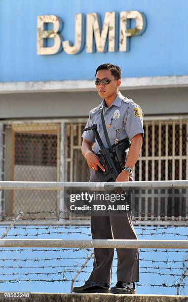 Security personnel of the Bureau of Jail Management and Penology stands guard at the perimeter of the maximum prison building where members of the...