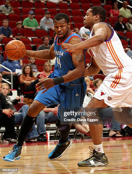 DeVon Hardin of the Tulsa 66ers tries to get a step past Darian Townes of the Iowa Energy in the first half of Game Three of their semi-final round...