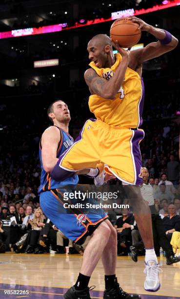 Kobe Bryant of the Los Angeles Lakers grabs a rebound in front of Nick Collison of the Oklahoma City Thunder during Game Two of the Western...