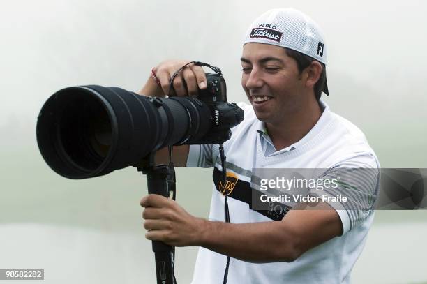 Pablo Larrazabal of Spain plays with a professional Nikon camera during the pro - am of the Ballantine's Championship at Pinx Golf Club on April 21,...
