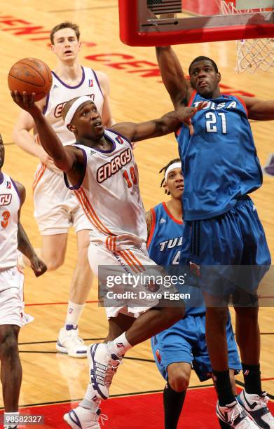 Curtis Stinson of the Iowa Energy shoots against Latavious Williams of the Tulsa 66ers in the second half of Game Three of their semi-final round...