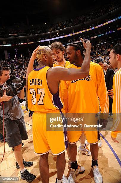 Ron Artest, Pau Gasol, and Josh Powell of the Los Angeles Lakers come together following their victory over the Oklahoma City Thunder in Game Two of...