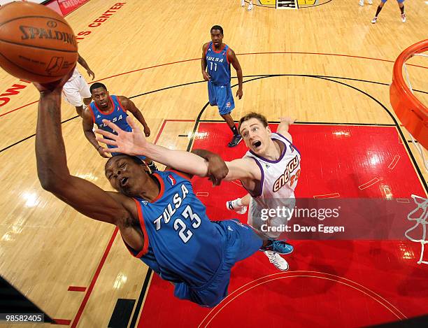 Larry Owens of the Tulsa 66ers battles for a rebound with Connor Atchley of the Iowa Energy in the first half of Game Three of their semi-final round...