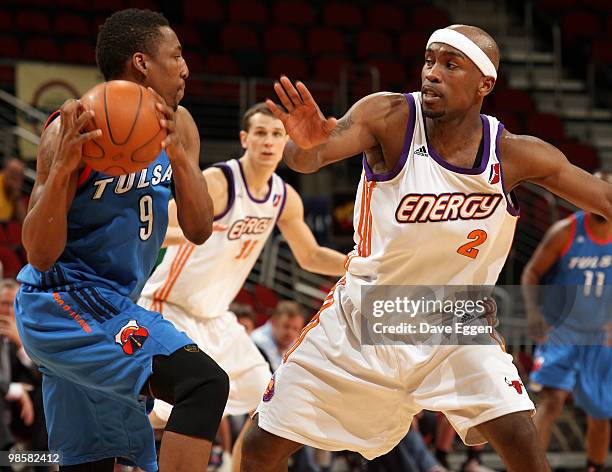 JaJuan Smith of the Tulsa 66ers looks for a teammate while Curtis Stinson of the Iowa Energy applies pressure in the second half of Game Three of...