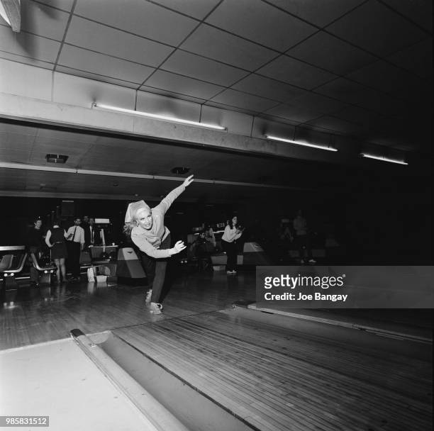 American actress, dancer, and singer Ginger Rogers playing bowling, UK, 11th March 1969.