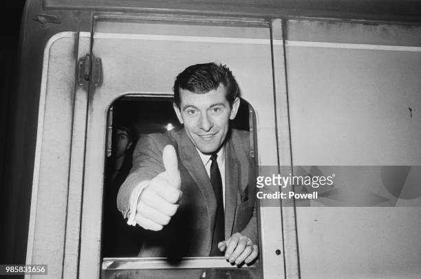 English soccer player Alan Mullery of Tottenham Hotspur FC leaving Euston Station for match against Manchester City FC, London, UK, 1st March 1969.