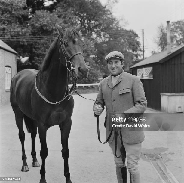 Racehorse trainer Dick Hern pictured with the racehorse Brigadier Gerard at Hern's stables in West Ilsley, Berkshire on 17th October 1972.