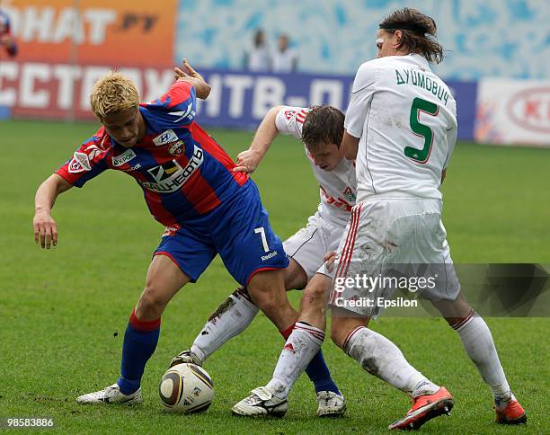 Keisuke Honda of PFC CSKA Moscow battles for the ball with Oleg Kuzmin and Tomislav Dujmovic of FC Lokomotiv Moscow during the Russian Football...