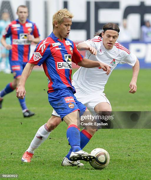 Keisuke Honda of PFC CSKA Moscow battles for the ball with Tomislav Dujmovic of FC Lokomotiv Moscow during the Russian Football League Championship...