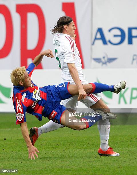 Keisuke Honda of PFC CSKA Moscow battles for the ball with Tomislav Dujmovic of FC Lokomotiv Moscow during the Russian Football League Championship...