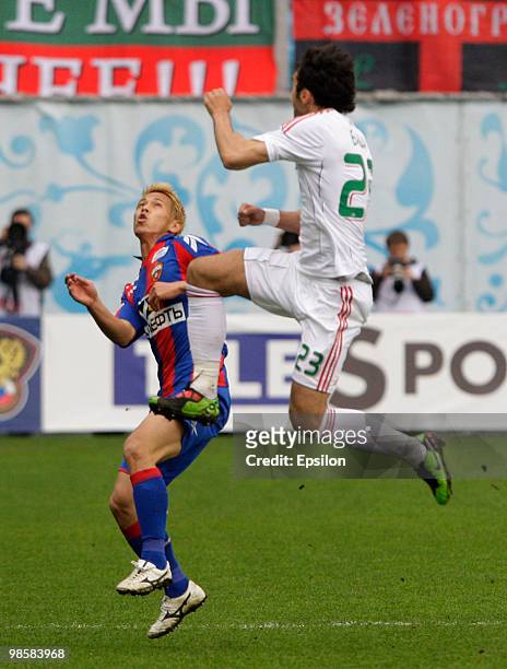 Keisuke Honda of PFC CSKA Moscow battles for the ball with Marko Basa of FC Lokomotiv Moscow during the Russian Football League Championship match...