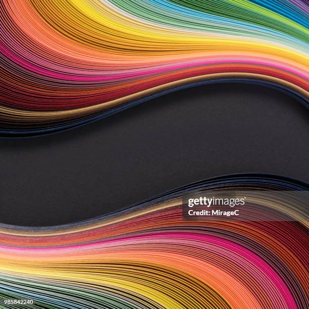 rainbow colored paper stripes flowing pattern - rolling stockfoto's en -beelden