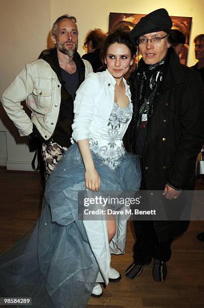 Ben Westwood, Triana de Lamo Terry and Adam Ant attend the launch event for Triana De Lamo Terry's exhibition 'Soho Lights' at Gallery 27 on April...
