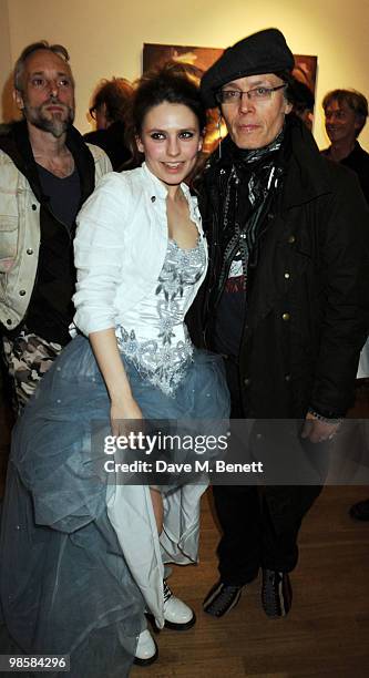 Ben Westwood, Triana de Lamo Terry and Adam Ant attend the launch event for Triana De Lamo Terry's exhibition 'Soho Lights' at Gallery 27 on April...