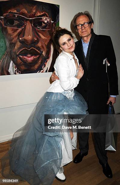 Triana de Lamo Terry and Bill Nighy attend the launch event for Triana De Lamo Terry's exhibition 'Soho Lights' at Gallery 27 on April 20, 2010 in...