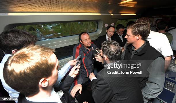 Rafael Benitez manager of Liverpool speaks to reporters during a press briefing in the buffet car of a train travelling from Paris to Bordeaux on...