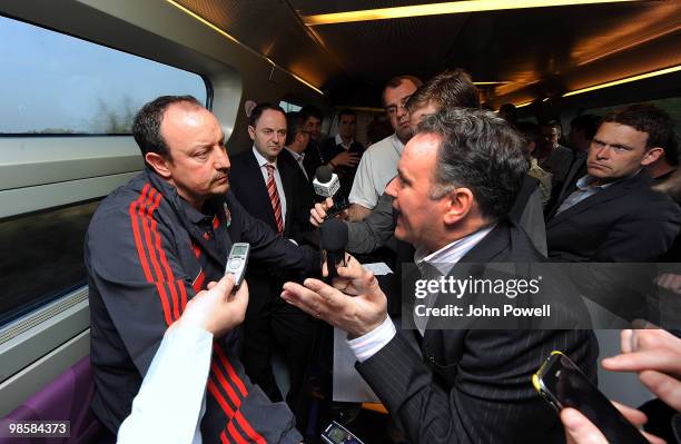 Rafael Benitez manager of Liverpool speaks to reporters during a press briefing in the buffet car of a train travelling from Paris to Bordeaux on...