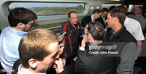 Rafael Benitez manager of Liverpool speaks to reporters during a press briefing in the buffet car of a train travelling from Paris to Bordeaux on...