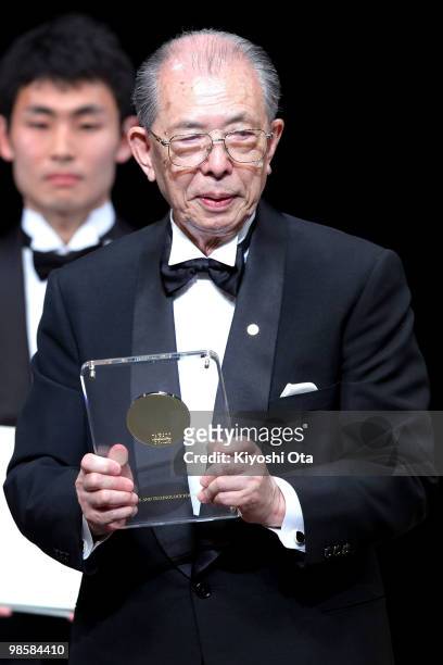 Japan Prize laureate Professor Shunichi Iwasaki of Japan holds a prize medal during the Japan Prize presentation ceremony at the National Theatre of...