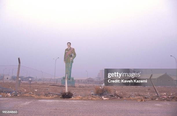 Huge board with a picture of Saddam Hussein stands erect inside a government ground in Baghdad, 2nd March 1991.