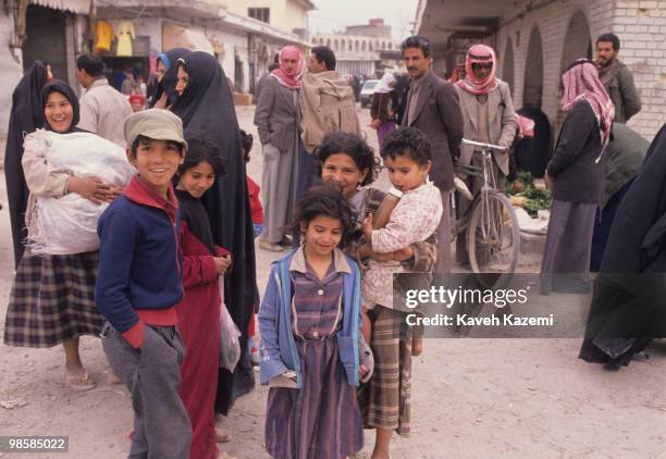 Children in a busy market place in Baghdad, 22nd February 1991.