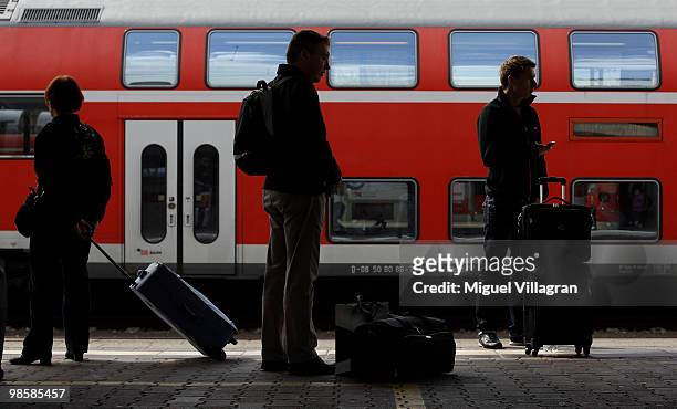 Passengers wait for the arrival of a train towards Munich on April 21, 2010 in Mannheim, Germany. European airspace that was closed by the volcanic...