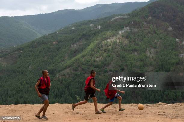 Bhutanese monks play soccer during their free time at the Dechen Phodrang monastery on June 14 in Thimphu, Bhutan. Around 250 monks reside at the...