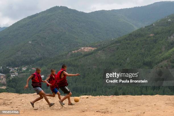 Bhutanese monks play soccer during their free time at the Dechen Phodrang monastery on June 14 in Thimphu, Bhutan. Around 250 monks reside at the...