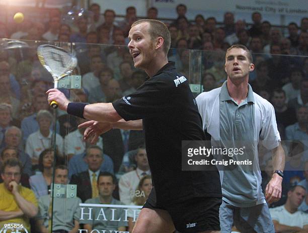 Peter Nicol of England [left] in action during his match with David Palmer of Australia in the final of the Halifax Equitable Super Squash Finals at...