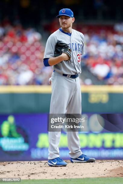 Mike Montgomery of the Chicago Cubs prepares to throw a pitch during the game against the Cincinnati Reds at Great American Ball Park on June 24,...