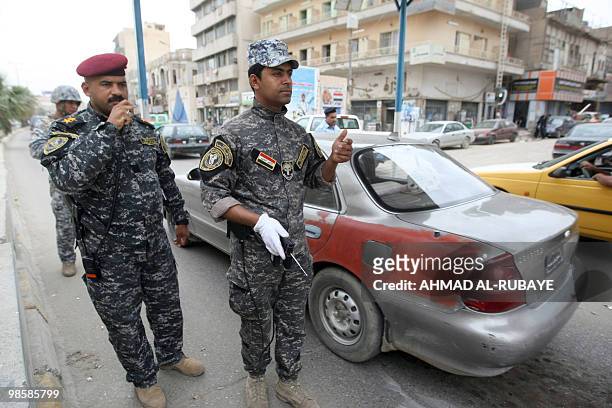 Iraqi security forces patrol a Baghdad street on April 21 as the government stepped up security to guard against any potential reprisals for the...