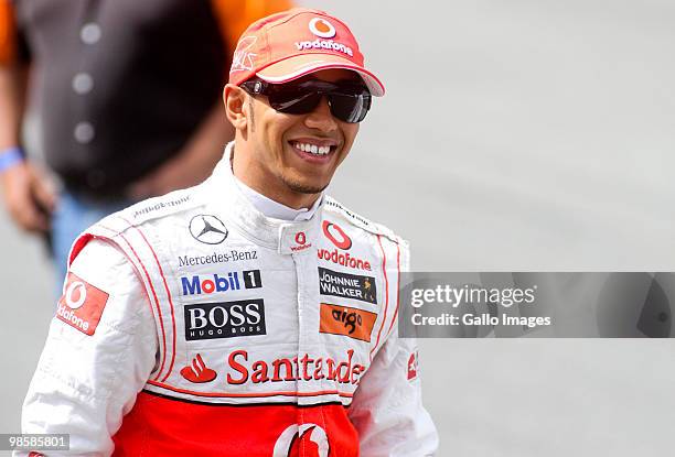 British Formula One driver Lewis Hamilton smiles during an event to race against a new Vodacom internet cable transferring 5.4 GB of data at Kyalami...