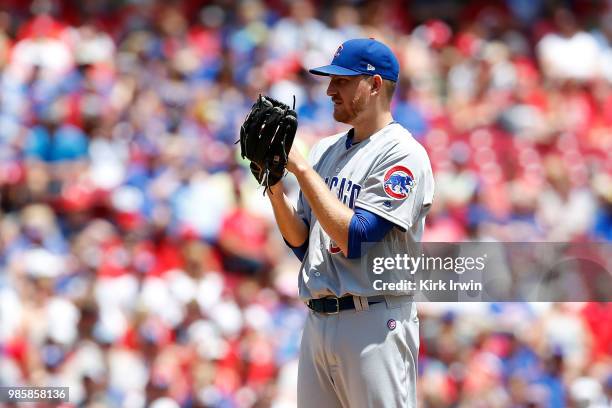 Mike Montgomery of the Chicago Cubs prepares to throw a pitch during the game against the Cincinnati Reds at Great American Ball Park on June 24,...