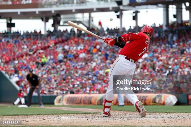 Eugenio Suarez of the Cincinnati Reds hits the ball during the game against the Chicago Cubs at Great American Ball Park on June 24, 2018 in...