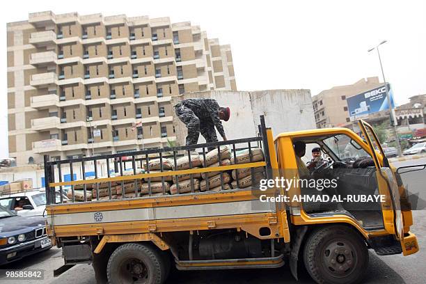 Iraqi security forces search a truck in Baghdad on April 21 as the government stepped up security to guard against any potential reprisals for the...