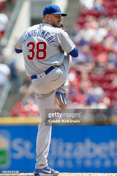 Mike Montgomery of the Chicago Cubs takes an at bat during the game against the Cincinnati Reds at Great American Ball Park on June 24, 2018 in...