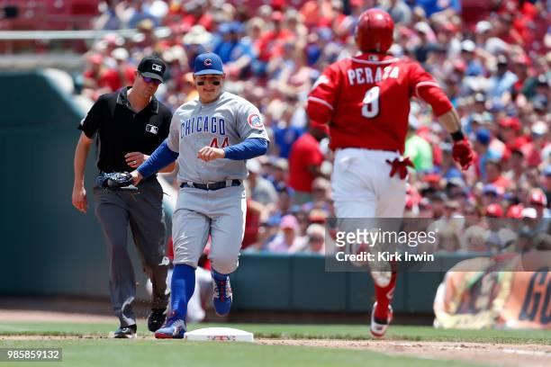Anthony Rizzo of the Chicago Cubs forces out Jose Peraza of the Cincinnati Reds at first base during the game at Great American Ball Park on June 24,...