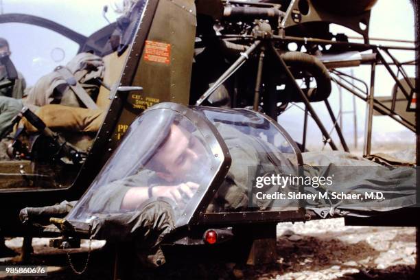 An uninjured US soldier lies on the stretcher platform of a evacuation helicopter at the 8063rd MASH , South Korea, January 1952.