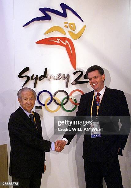 President of the International Olympic Committee Juan Antonio Samaranch is welcomed by Sydney's Olympic Minister Michael Knight at Sydney Airport, 04...