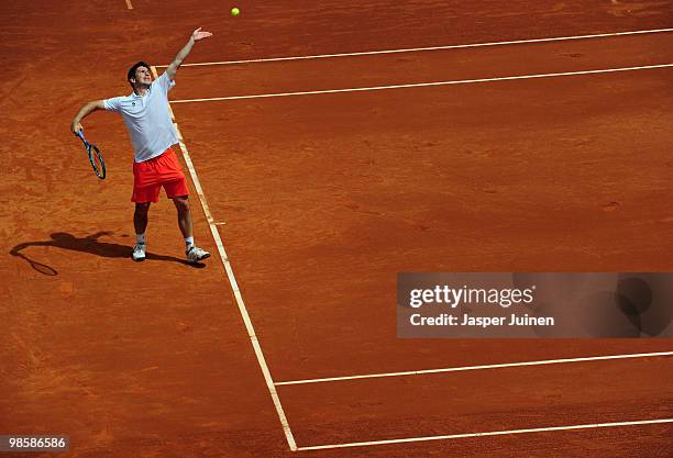 Jan Hajek of the Czech Republic serves the ball to Jo-Wilfried Tsonga of France on day three of the ATP 500 World Tour Barcelona Open Banco Sabadell...