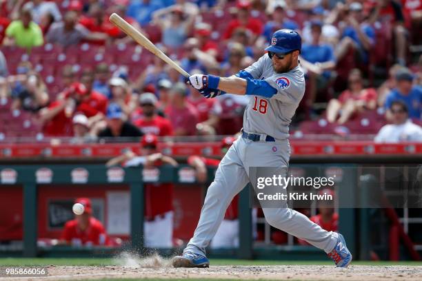 Ben Zobrist of the Chicago Cubs takes an at bat during the game against the Cincinnati Reds at Great American Ball Park on June 24, 2018 in...