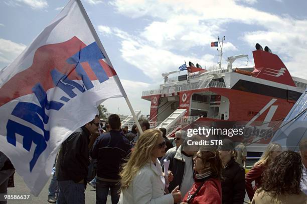 Greek unionists representing Communist workers block the entrance to ferries on April 21, 2010 preventing their departure from the port of Piraeus...