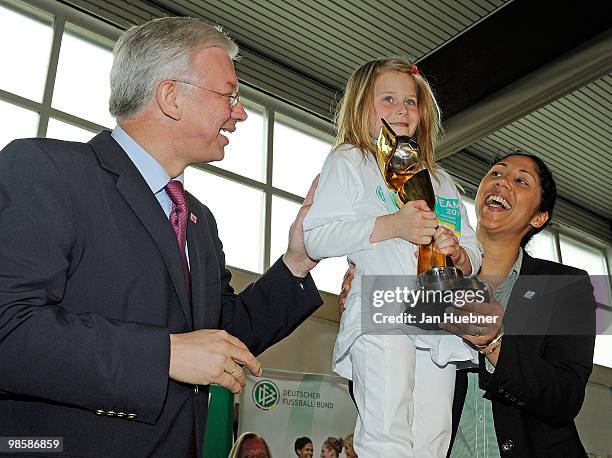Roland Koch, Prime Minister of Hesse and President of the Organising Committee Germany of the FIFA Women's World Cup 2011 Steffi Jones applaud while...